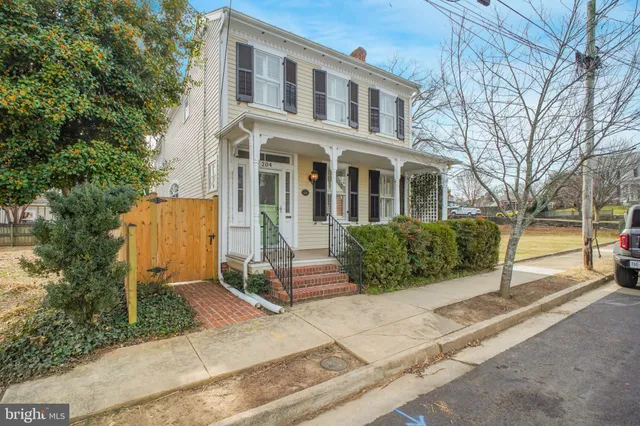 a view of a balcony with a door and windows