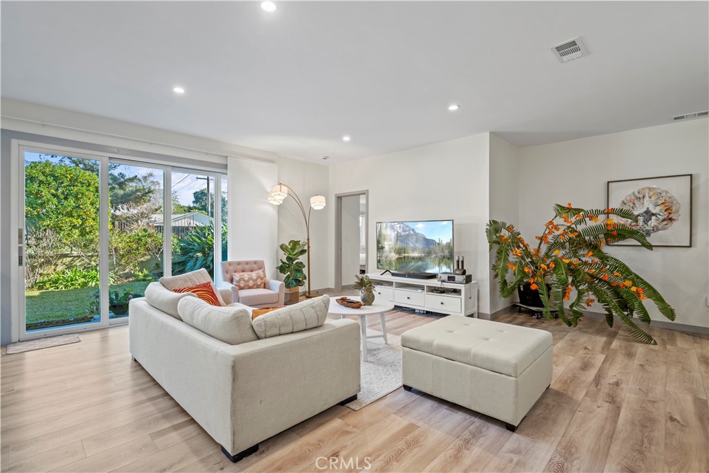 4704 Briggs Avenue La Crescenta, CA 91214 - Photo 11 of 28 a living room with furniture and a large window