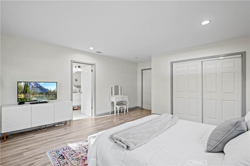 4704 Briggs Avenue La Crescenta, CA 91214 - Photo 15 of 28 a bedroom with a bed and a chair