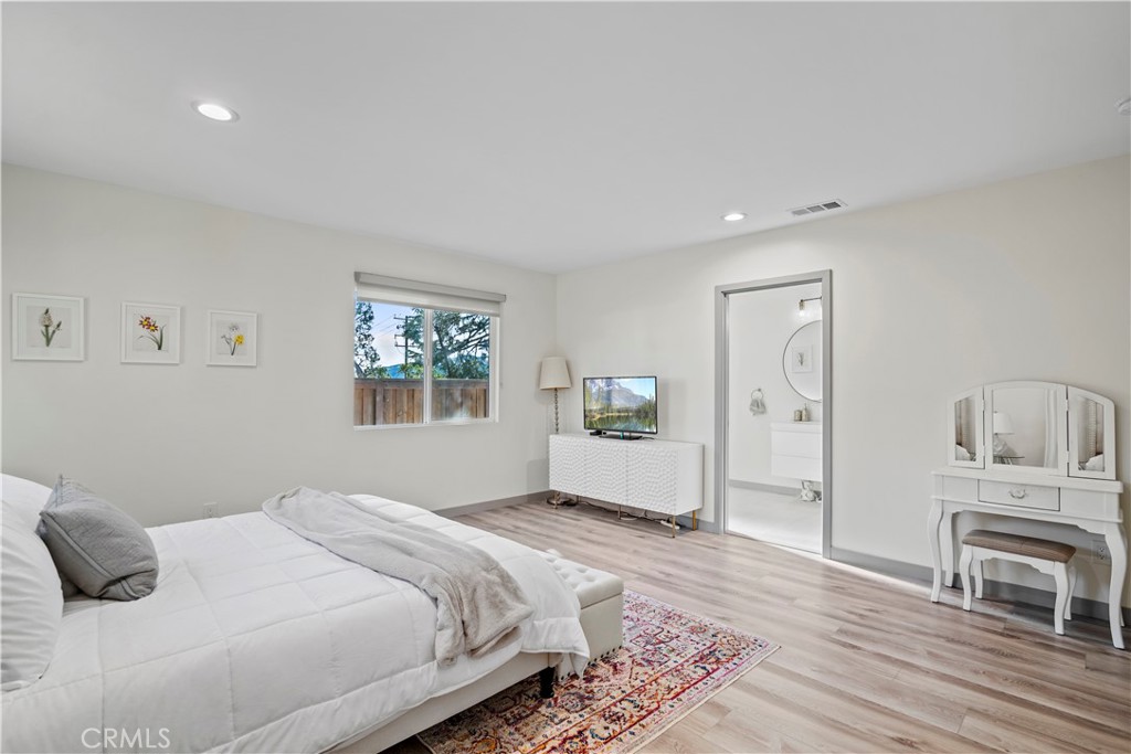 4704 Briggs Avenue La Crescenta, CA 91214 - Photo 16 of 28 a bedroom with a large bed and a window