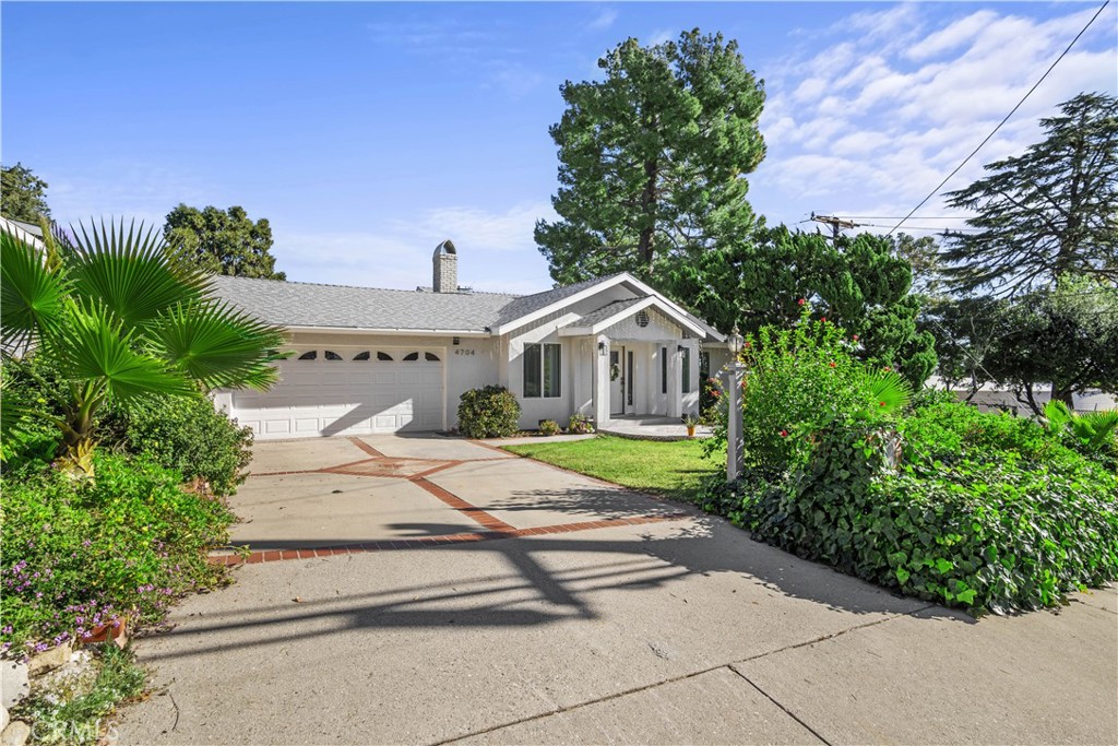 4704 Briggs Avenue La Crescenta, CA 91214 - Photo 26 of 28 a front view of a house with garden