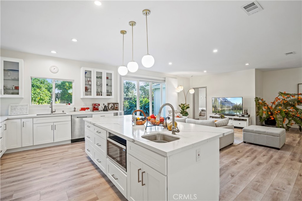 4704 Briggs Avenue La Crescenta, CA 91214 - Photo 10 of 28 a kitchen with a sink stove and cabinets