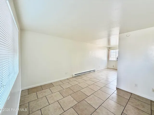 an empty room with a bench