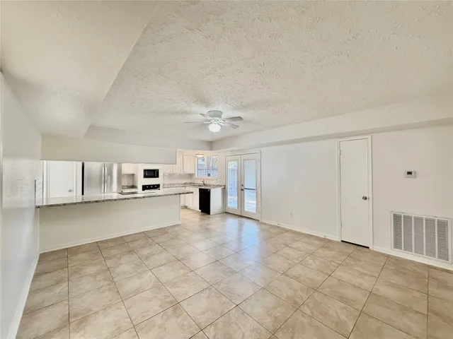 a view of a kitchen with a sink and dishwasher