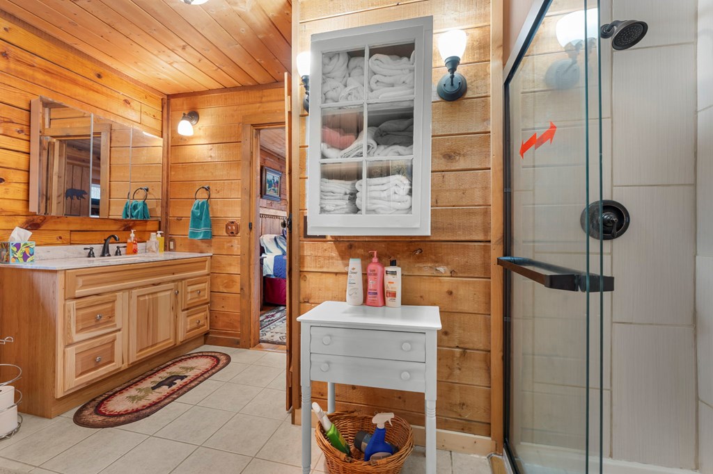 451 Summit Road Otto, NC 28763 - Photo 24 of 40 a bathroom with a sink and a mirror