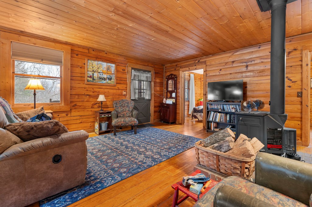 451 Summit Road Otto, NC 28763 - Photo 8 of 40 a living room with furniture and a flat screen tv