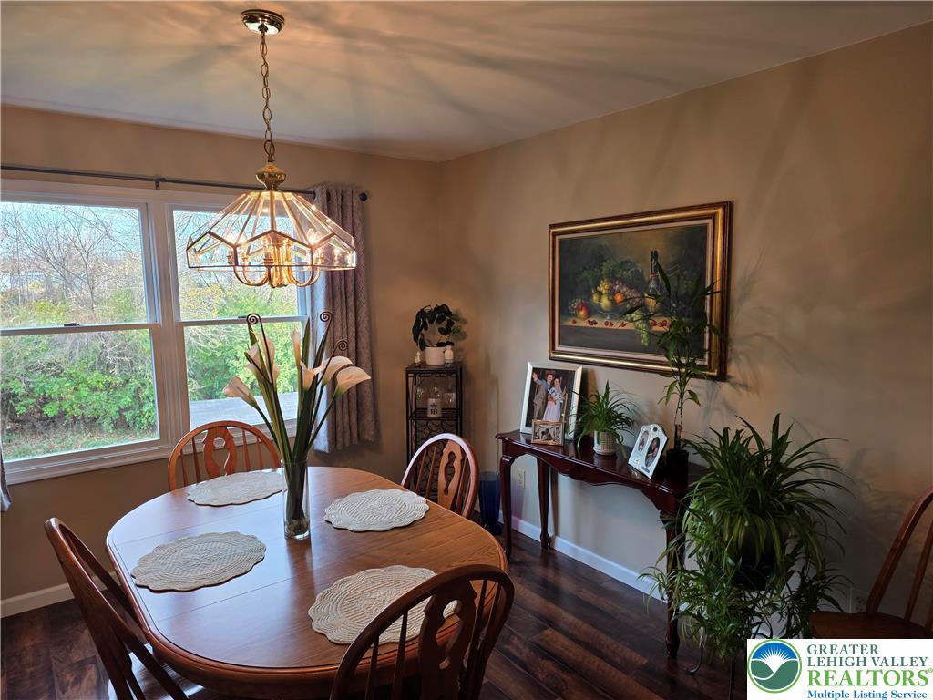 844 Catherine Drive Coplay, PA 18037 - Photo 25 of 52 a dining room with furniture potted plants and wooden floor
