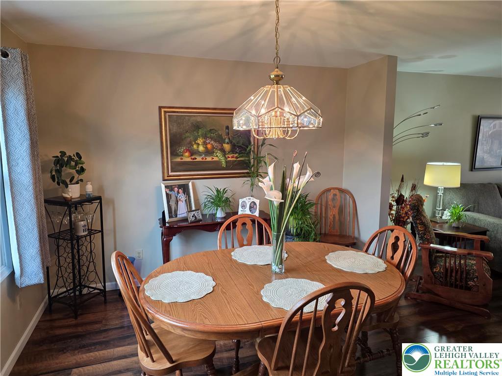 844 Catherine Drive Coplay, PA 18037 - Photo 26 of 52 a view of a dining room with furniture wooden floor and chandelier