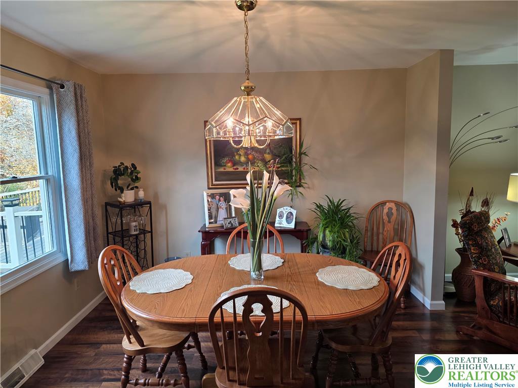 844 Catherine Drive Coplay, PA 18037 - Photo 27 of 52 a dining room with furniture a chandelier and wooden floor