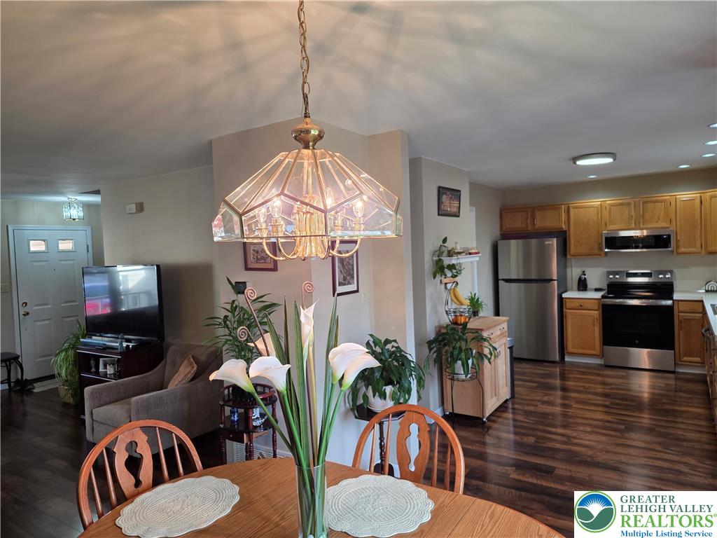 844 Catherine Drive Coplay, PA 18037 - Photo 30 of 52 a kitchen with stainless steel appliances kitchen island granite countertop a living room dining room and kitchen view