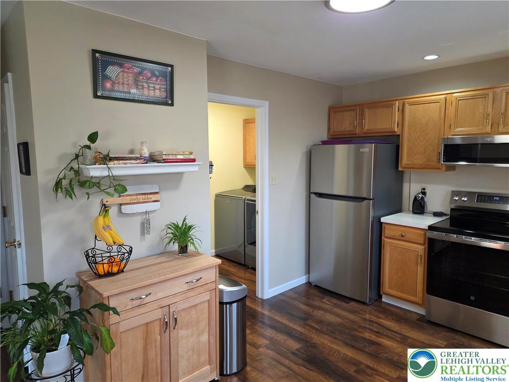 844 Catherine Drive Coplay, PA 18037 - Photo 35 of 52 a kitchen with stainless steel appliances kitchen island granite countertop a refrigerator and a stove