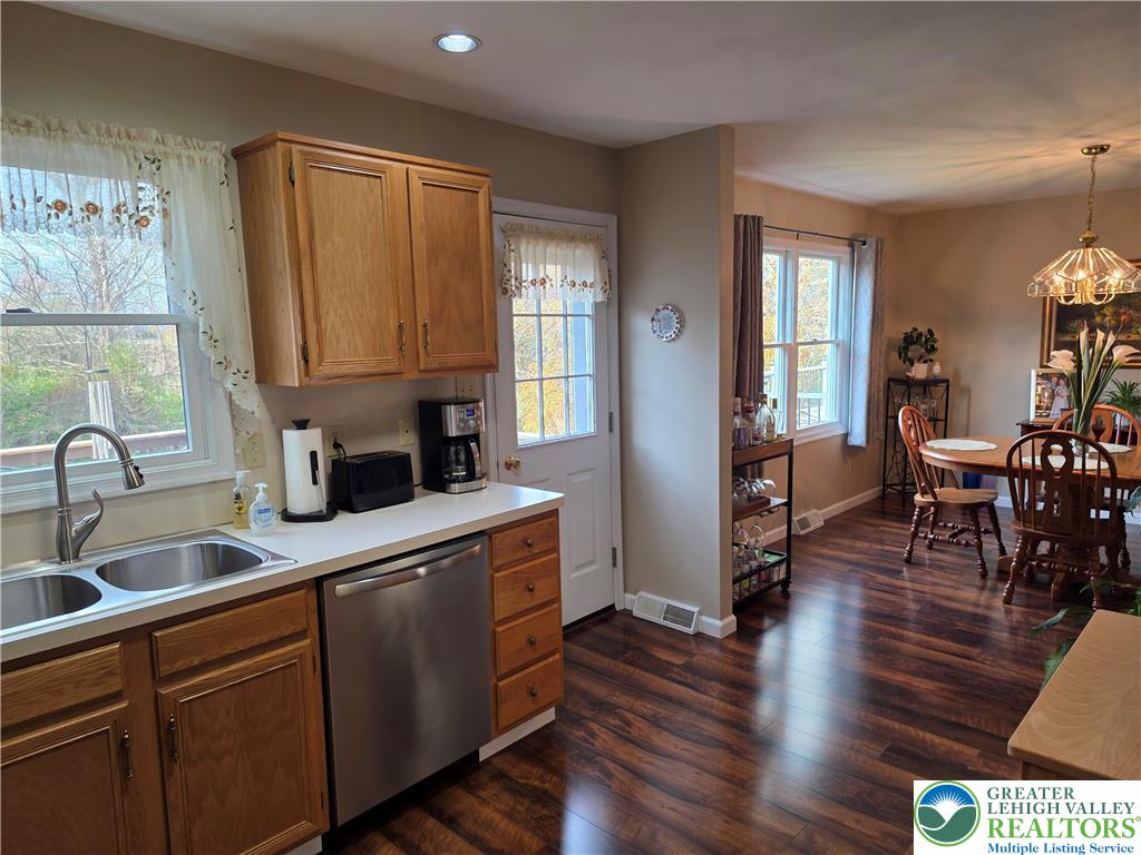844 Catherine Drive Coplay, PA 18037 - Photo 37 of 52 a kitchen with stainless steel appliances granite countertop a sink a stove cabinets and wooden floor