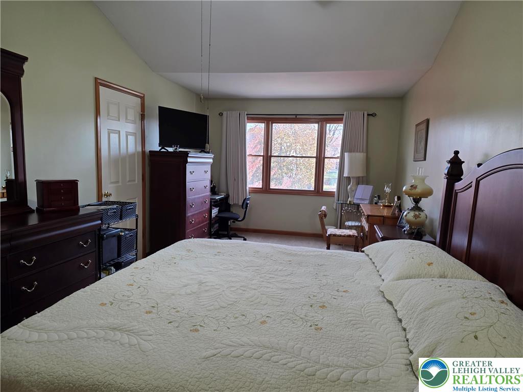 844 Catherine Drive Coplay, PA 18037 - Photo 44 of 52 a bed room with a bed window and a television