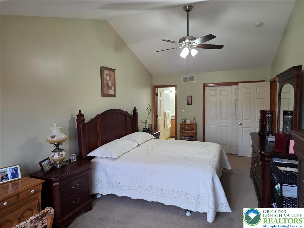 844 Catherine Drive Coplay, PA 18037 - Photo 45 of 52 a bedroom with a bed and ceiling fan