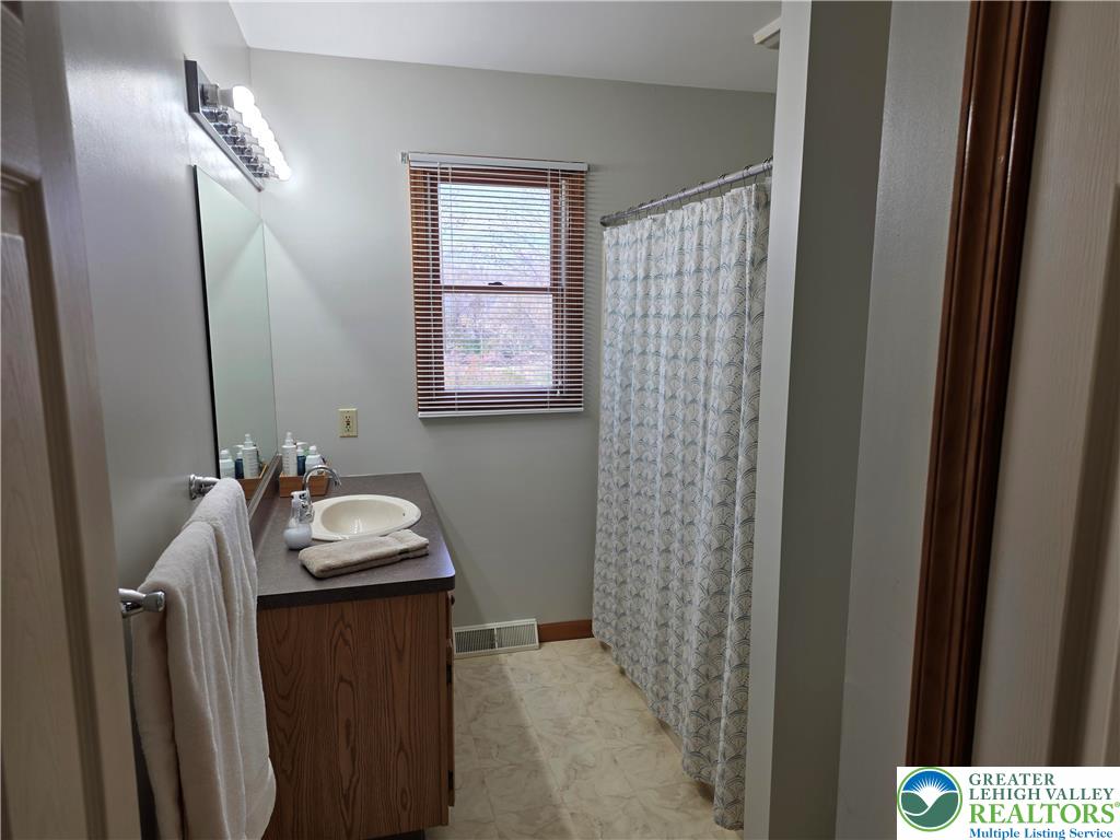 844 Catherine Drive Coplay, PA 18037 - Photo 47 of 52 a bathroom with a sink a toilet and mirror