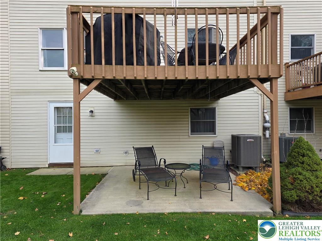 844 Catherine Drive Coplay, PA 18037 - Photo 7 of 52 a view of a chairs and table in the back yard of the house