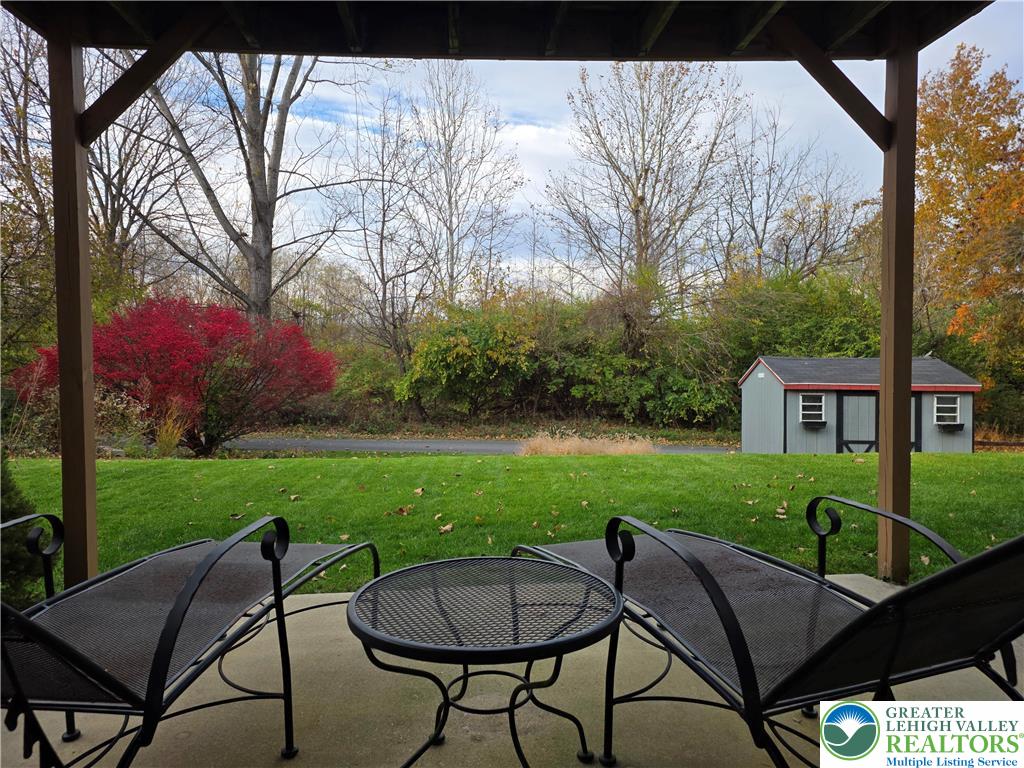 844 Catherine Drive Coplay, PA 18037 - Photo 10 of 52 a view of a chairs and table in backyard of a house