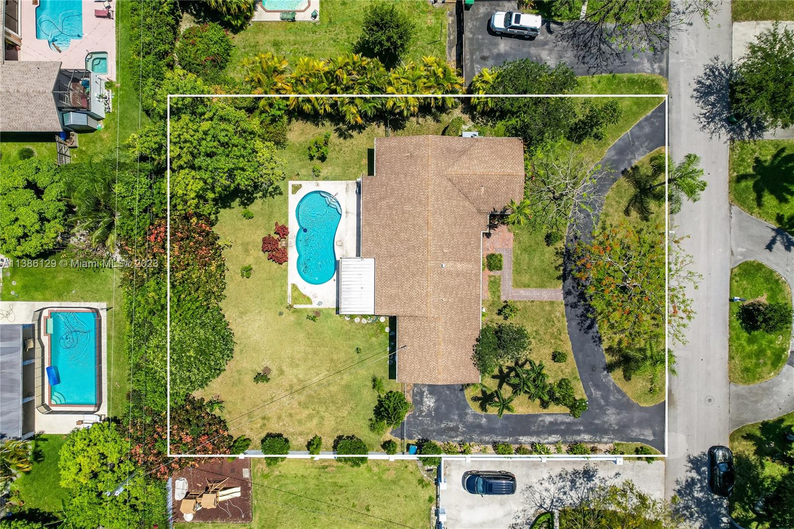 an aerial view of house with a swimming pool