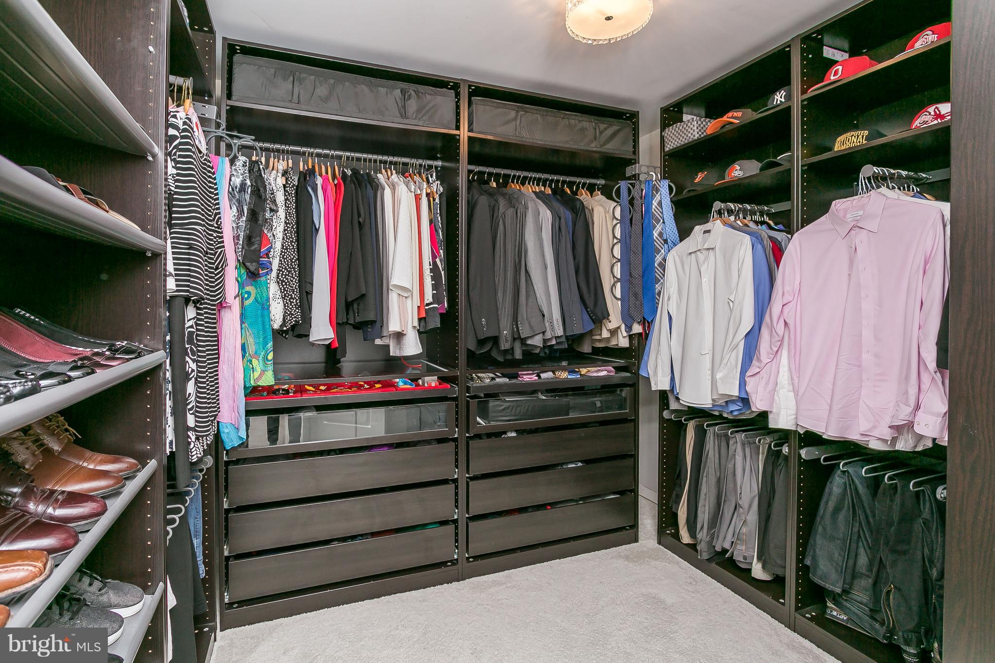 10538 Braddock Run Road Baltimore, MD 21220 - Photo 14 of 39 a view of walk in closet with clothes and shoes