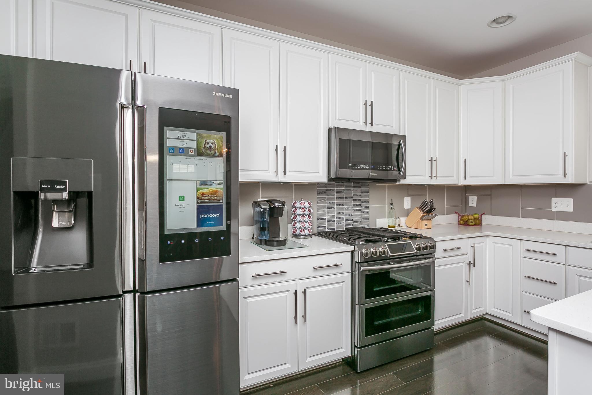 10538 Braddock Run Road Baltimore, MD 21220 - Photo 3 of 39 a kitchen with stainless steel appliances granite countertop a refrigerator stove and sink