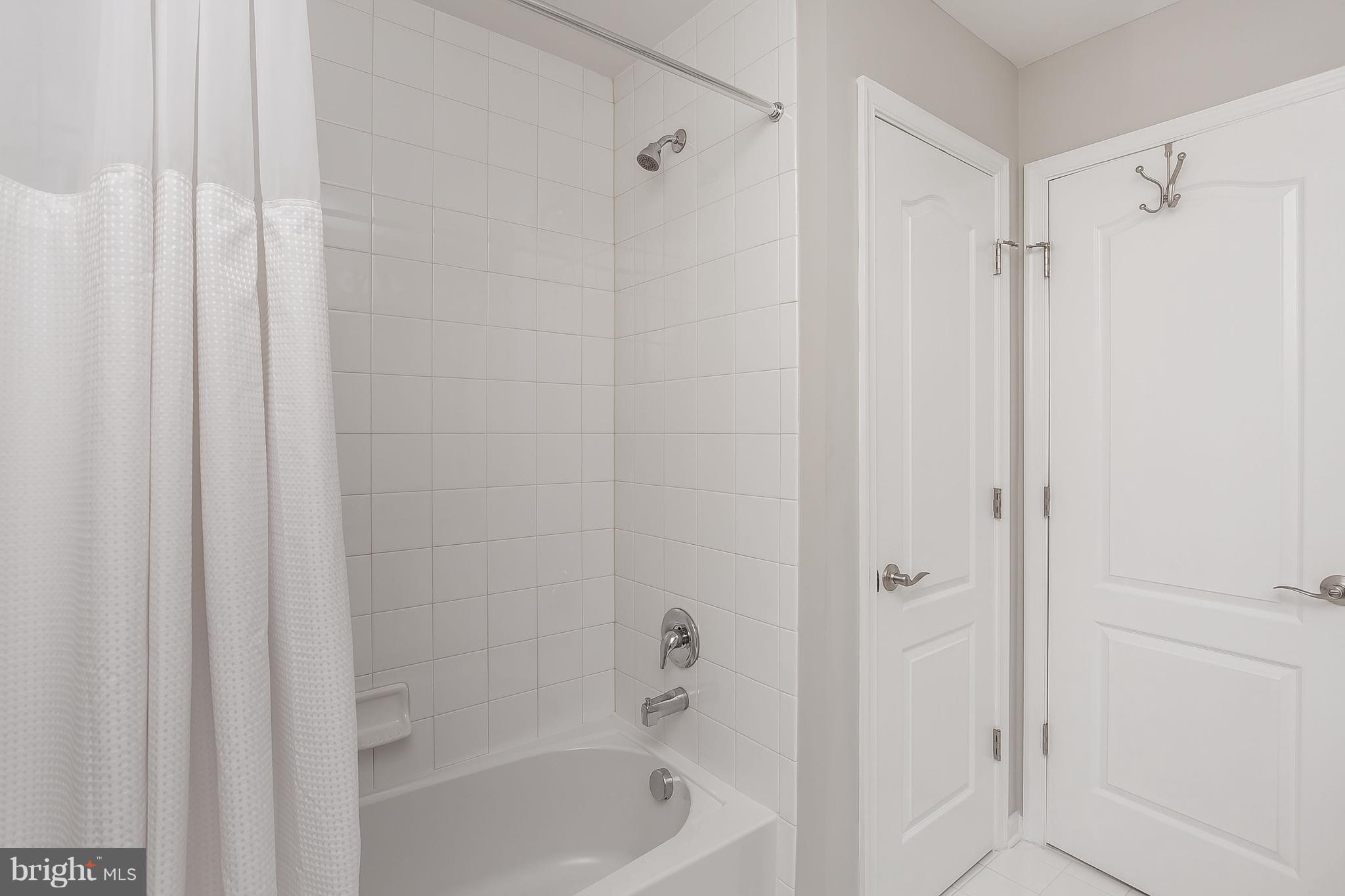 10538 Braddock Run Road Baltimore, MD 21220 - Photo 22 of 39 a bathroom with a shower and a bath tub
