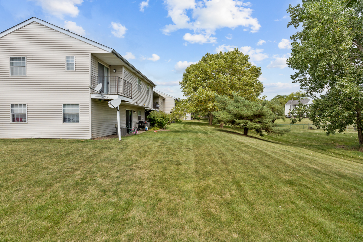 106 Gant Circle, Unit H Streamwood, IL 60107 - Photo 16 of 20 a view of a house with a yard