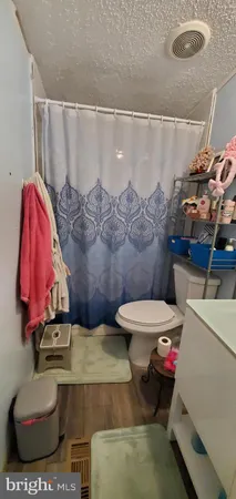 a view of a hallway with furniture and toys