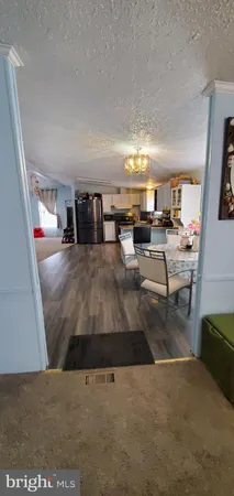 a kitchen with a refrigerator and a stove