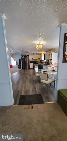 a kitchen with a refrigerator and a stove