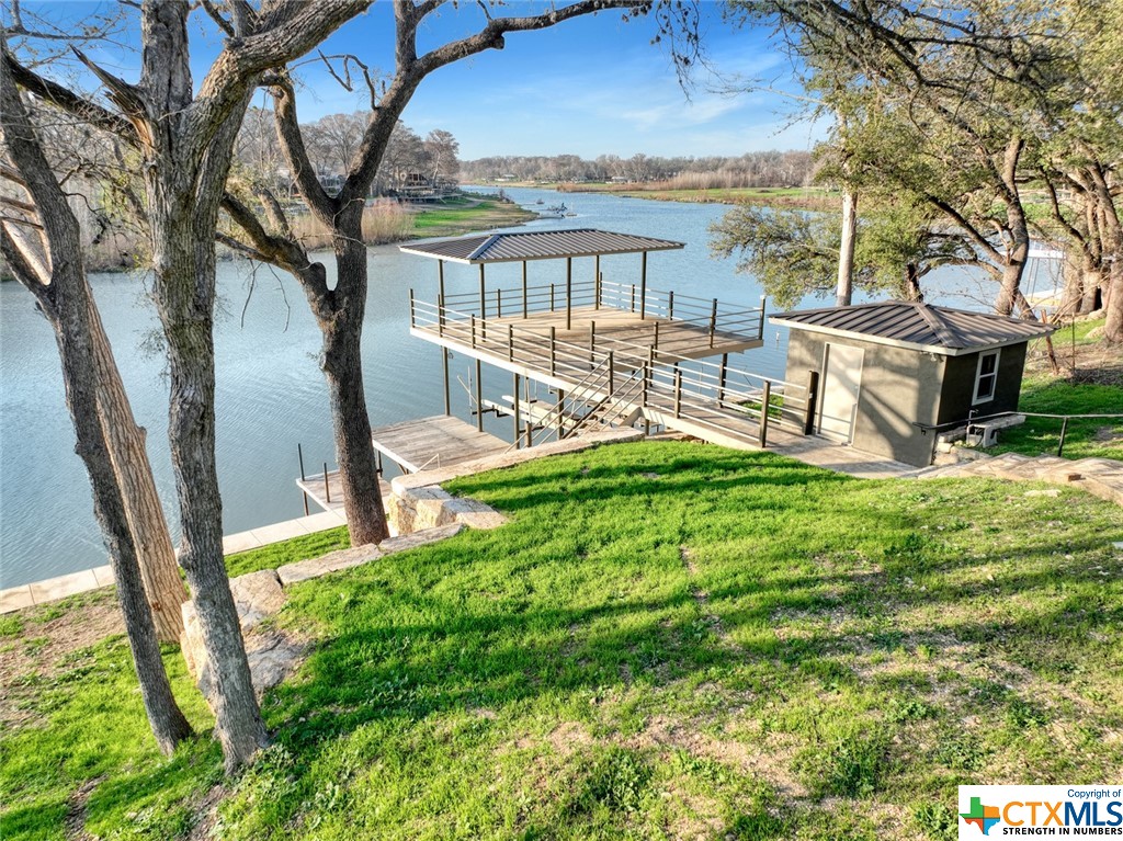 a view of a chairs and table in the balcony