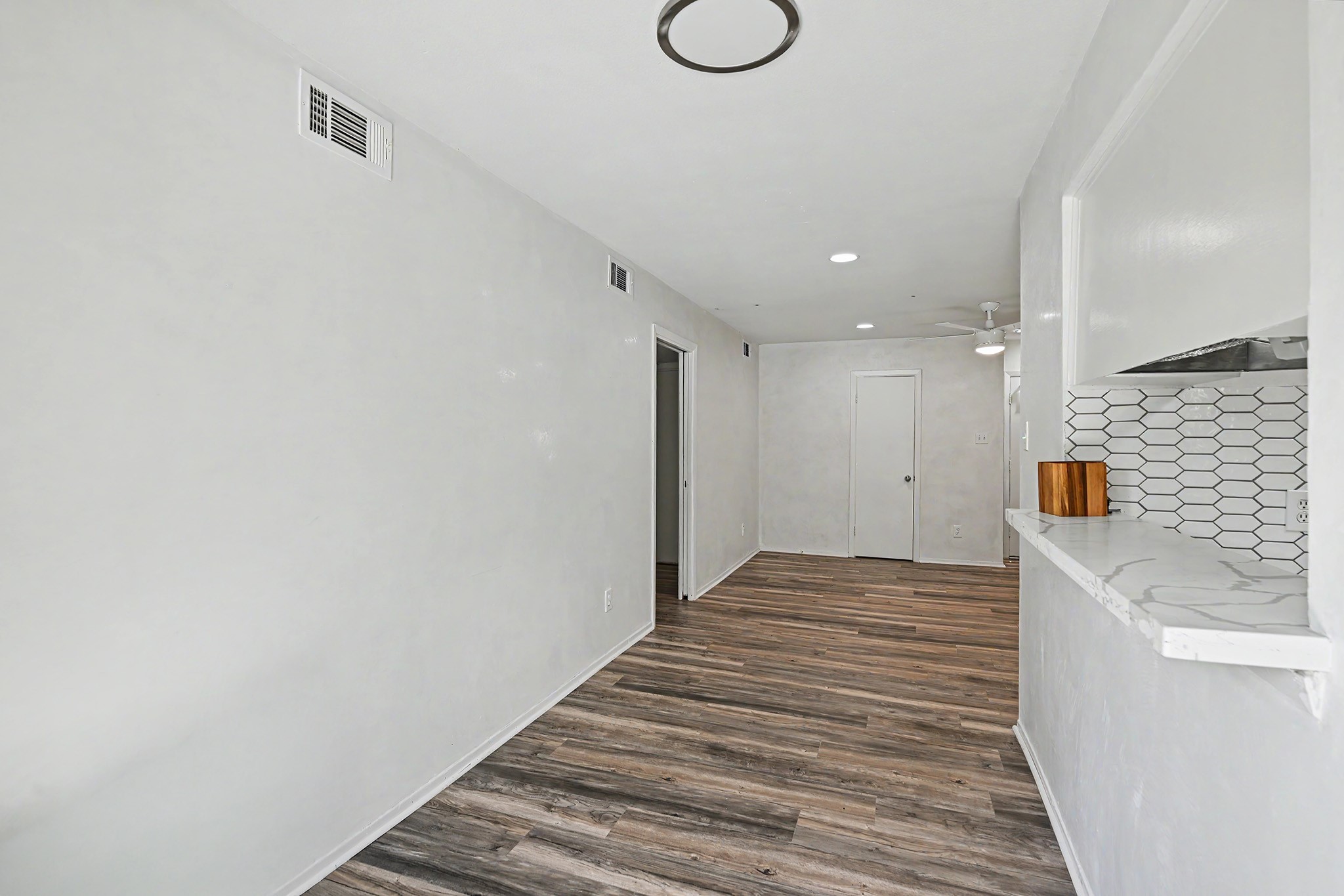 8211 Kingsbrook Road, Unit 205 Houston, TX 77024 - Photo 10 of 23 Recent updated lighting, flooring, countertops and backsplash.