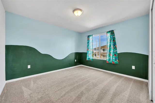 a view of a room with window and bathroom