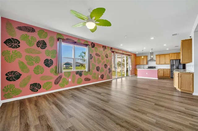 a view of kitchen with furniture and wooden floor