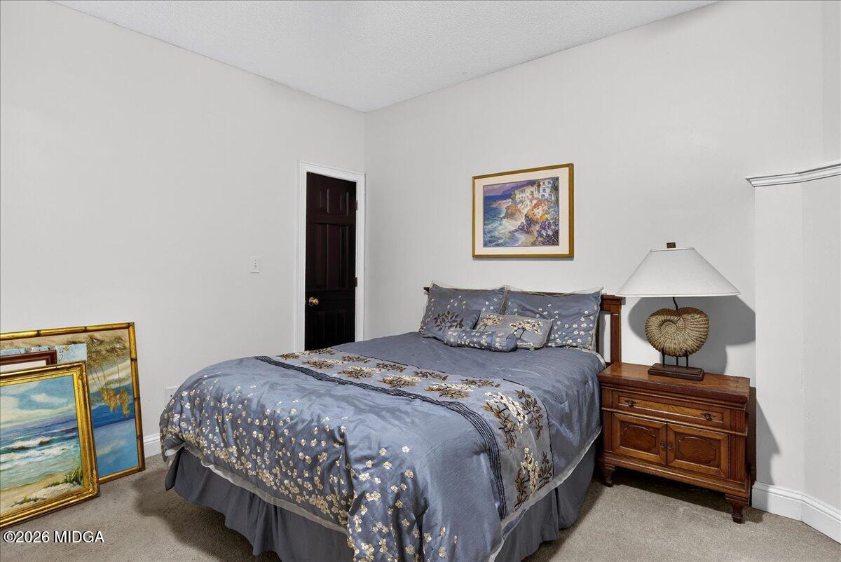 518 River Overlook Forsyth, GA 31029 - Photo 41 of 96 a bedroom with a bed and cabinet