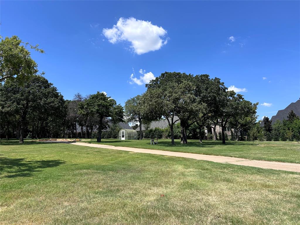 Tbd - Lot 3 Tbd - Road Colleyville, TX 76034 - Photo 6 of 8 a backyard of a house with lots of green space and outdoor space