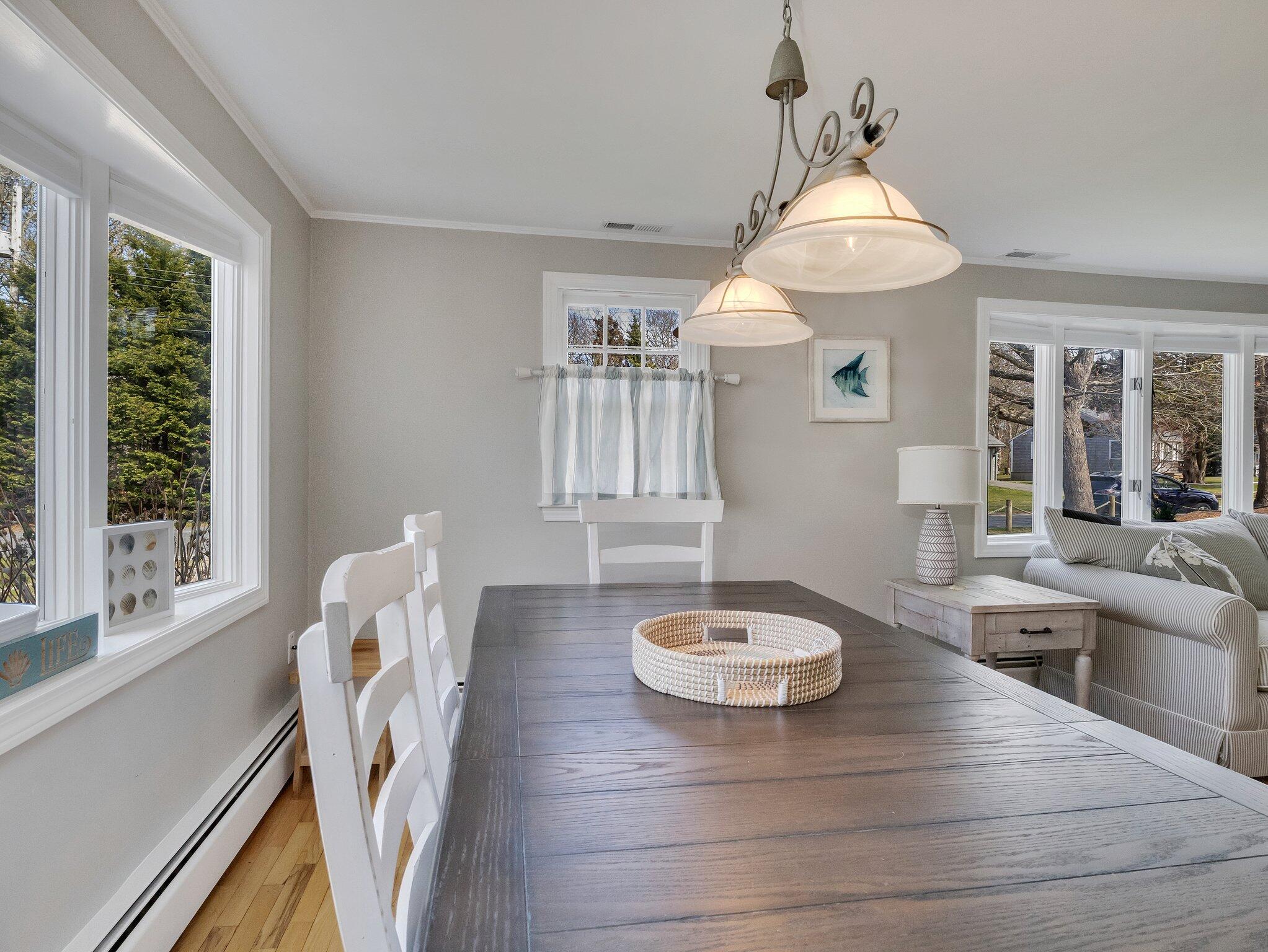 41 Harbor Road West Yarmouth, MA 02673 - Photo 14 of 56 a view of a dining room with furniture window and outside view