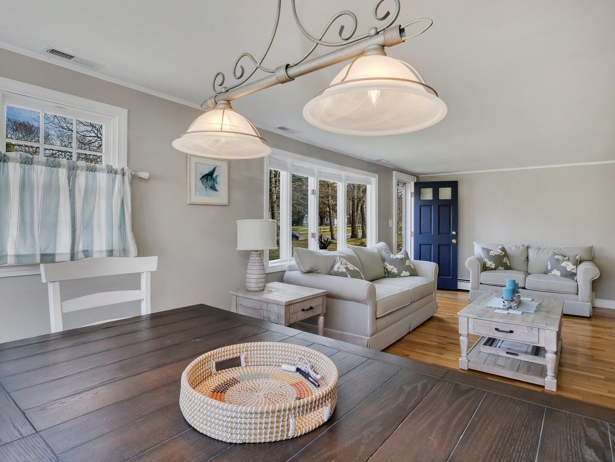 41 Harbor Road West Yarmouth, MA 02673 - Photo 15 of 56 a living room with furniture a table and wooden floor