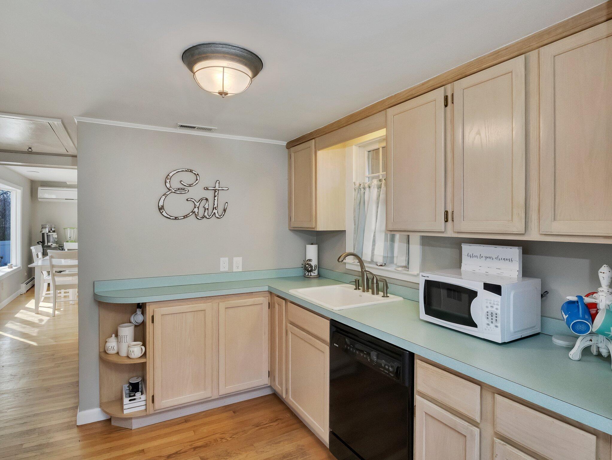 41 Harbor Road West Yarmouth, MA 02673 - Photo 17 of 56 a kitchen with a sink cabinets and a window