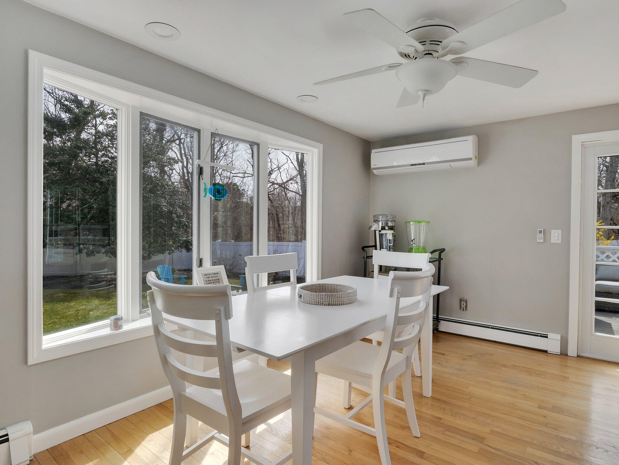 41 Harbor Road West Yarmouth, MA 02673 - Photo 20 of 56 a dining room with furniture a chandelier and wooden floor