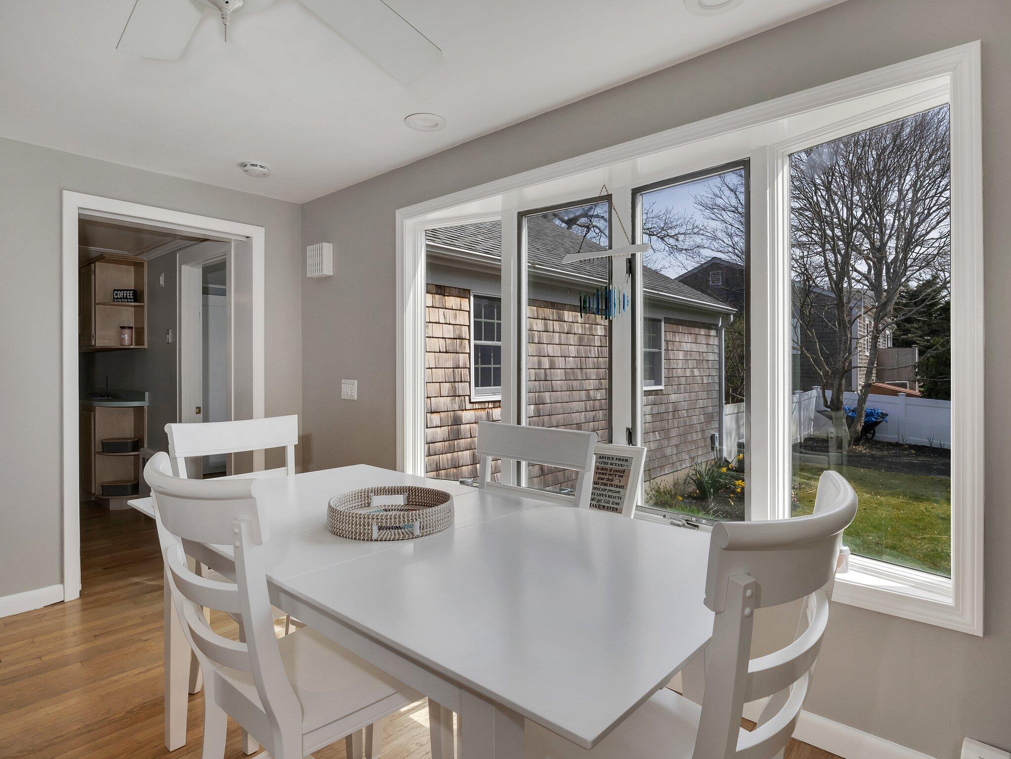 41 Harbor Road West Yarmouth, MA 02673 - Photo 21 of 56 a view of a dining room with furniture window and wooden floor