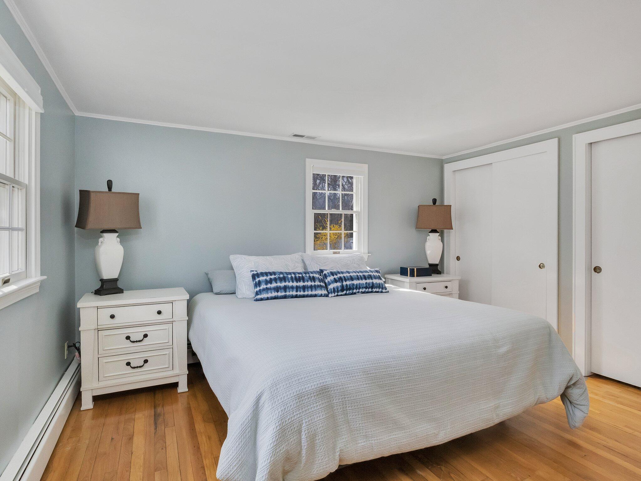 41 Harbor Road West Yarmouth, MA 02673 - Photo 25 of 56 a bedroom with a bed and wooden floor
