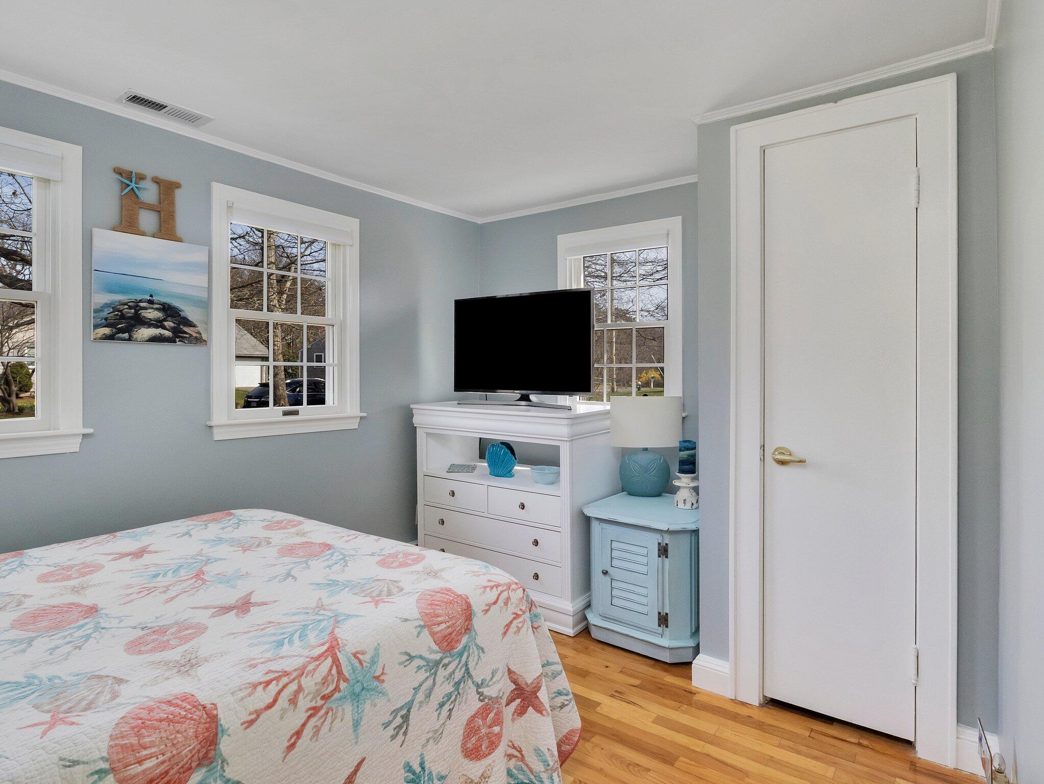 41 Harbor Road West Yarmouth, MA 02673 - Photo 30 of 56 a bedroom with a bed and a flat screen tv