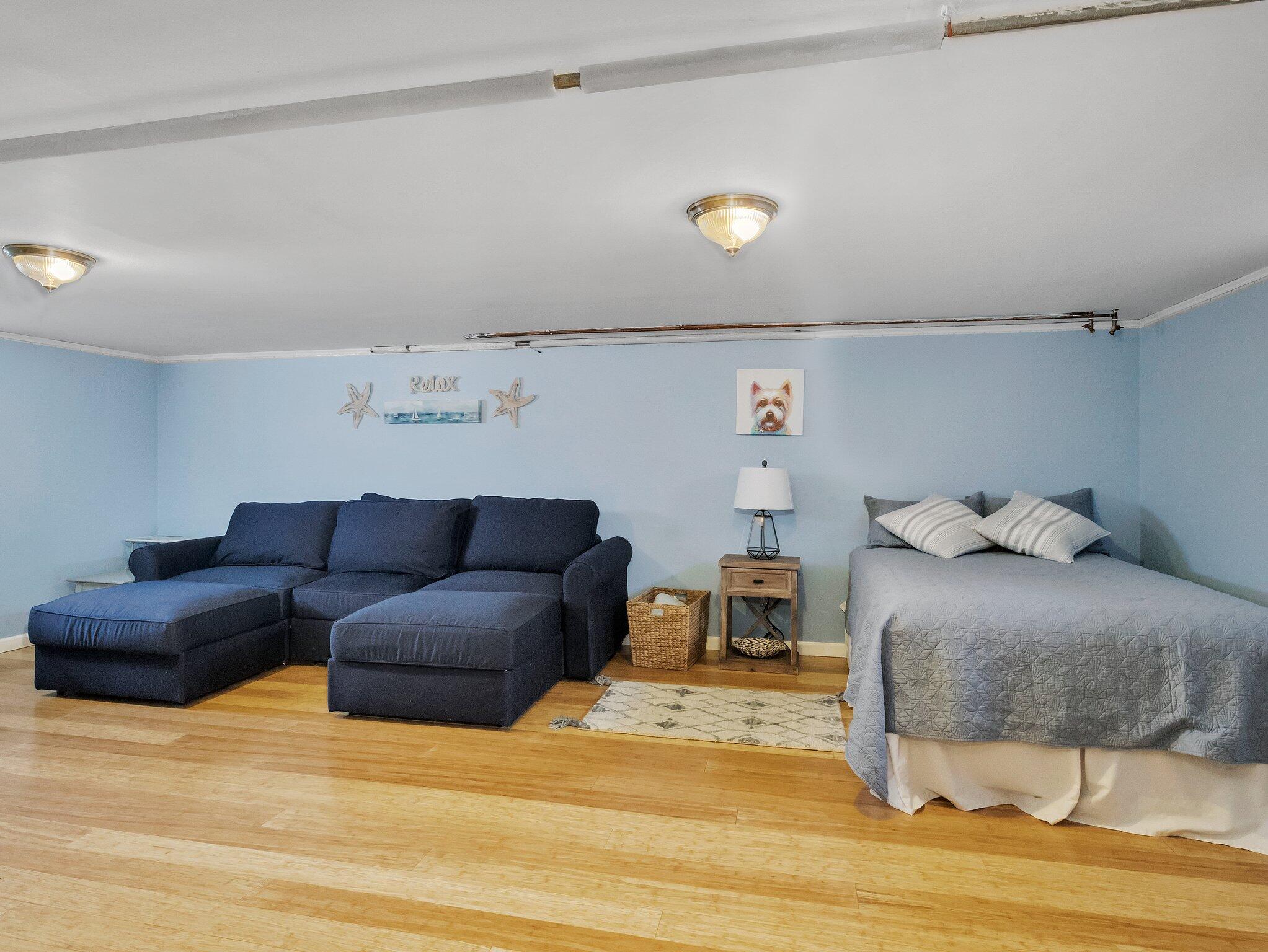 41 Harbor Road West Yarmouth, MA 02673 - Photo 32 of 56 a bedroom with a bed and a couch