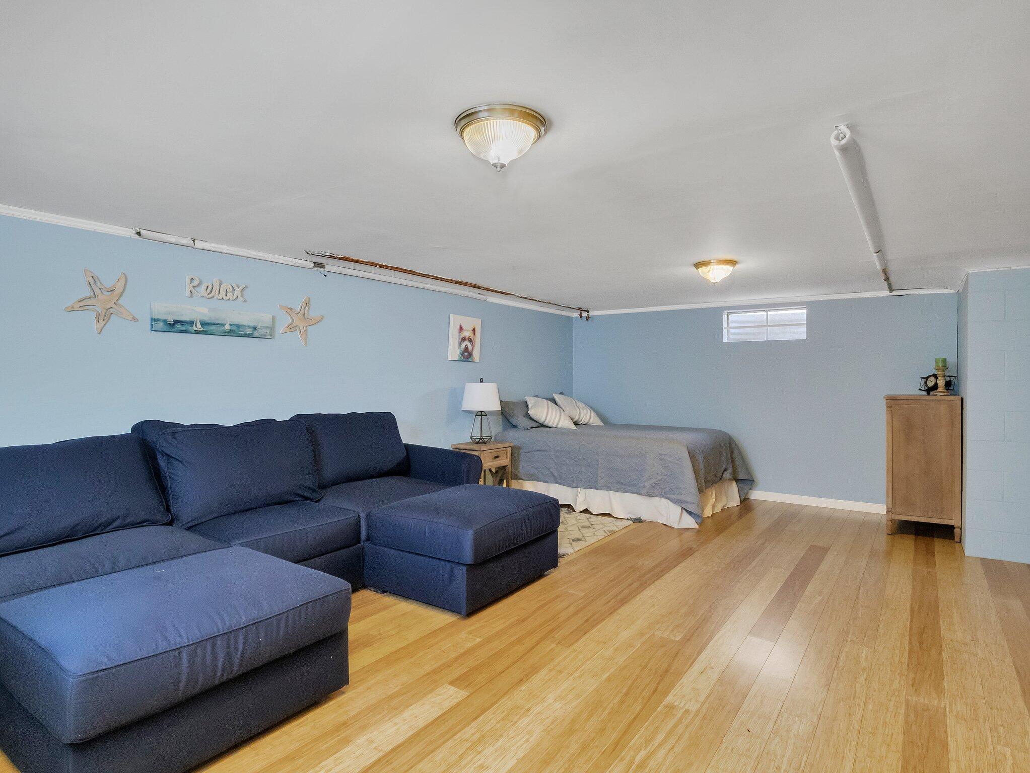 41 Harbor Road West Yarmouth, MA 02673 - Photo 33 of 56 a bedroom with furniture and a wooden floor