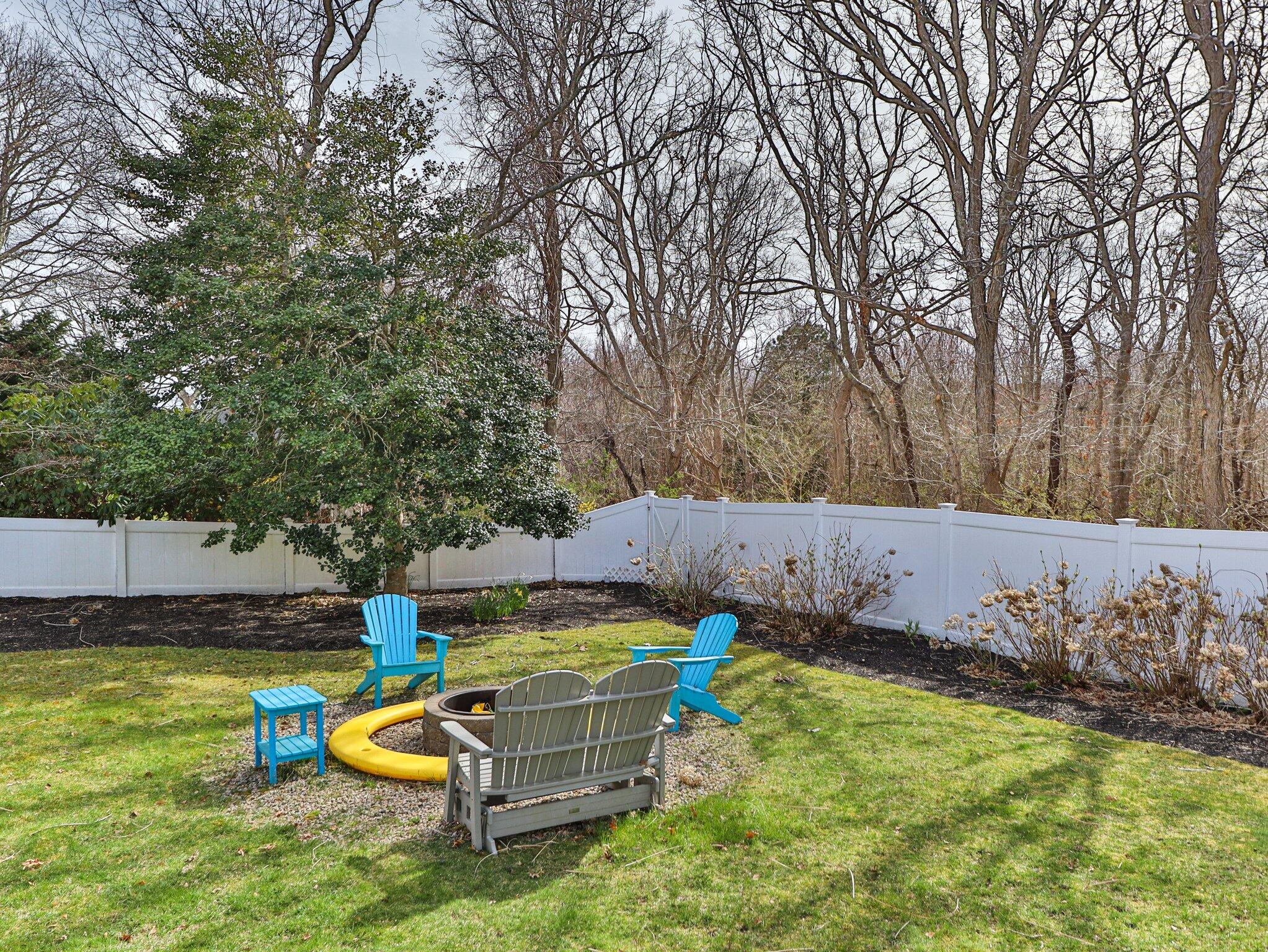 41 Harbor Road West Yarmouth, MA 02673 - Photo 39 of 56 a view of a backyard with table and chairs
