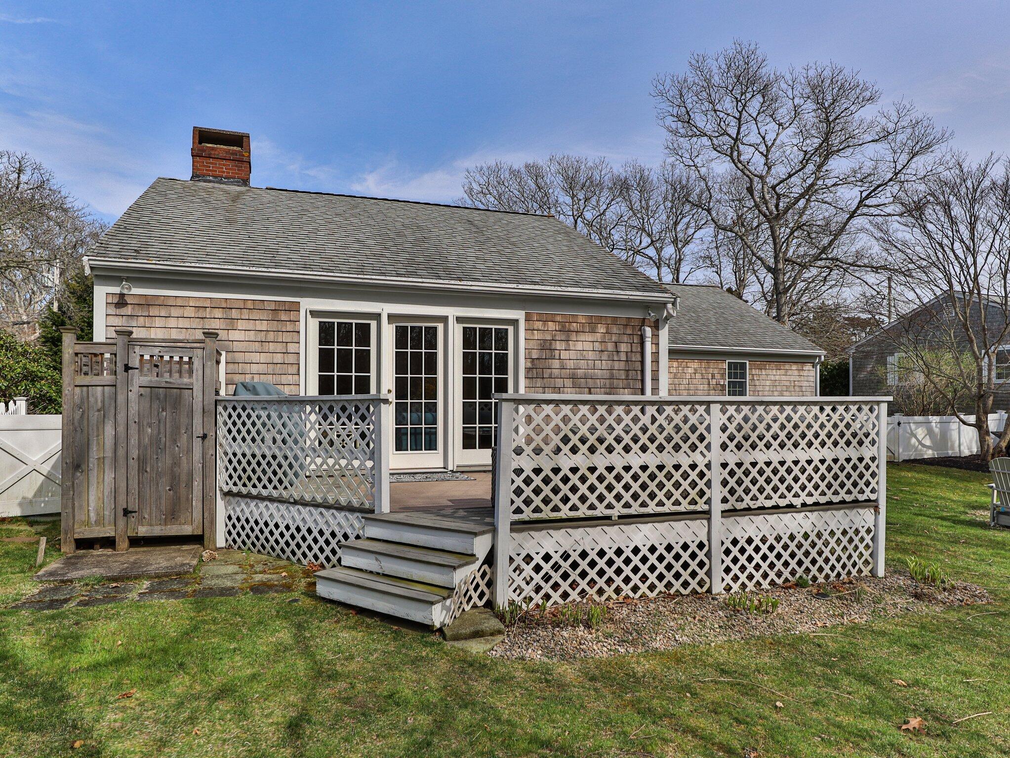 41 Harbor Road West Yarmouth, MA 02673 - Photo 40 of 56 a front view of a house with a garden