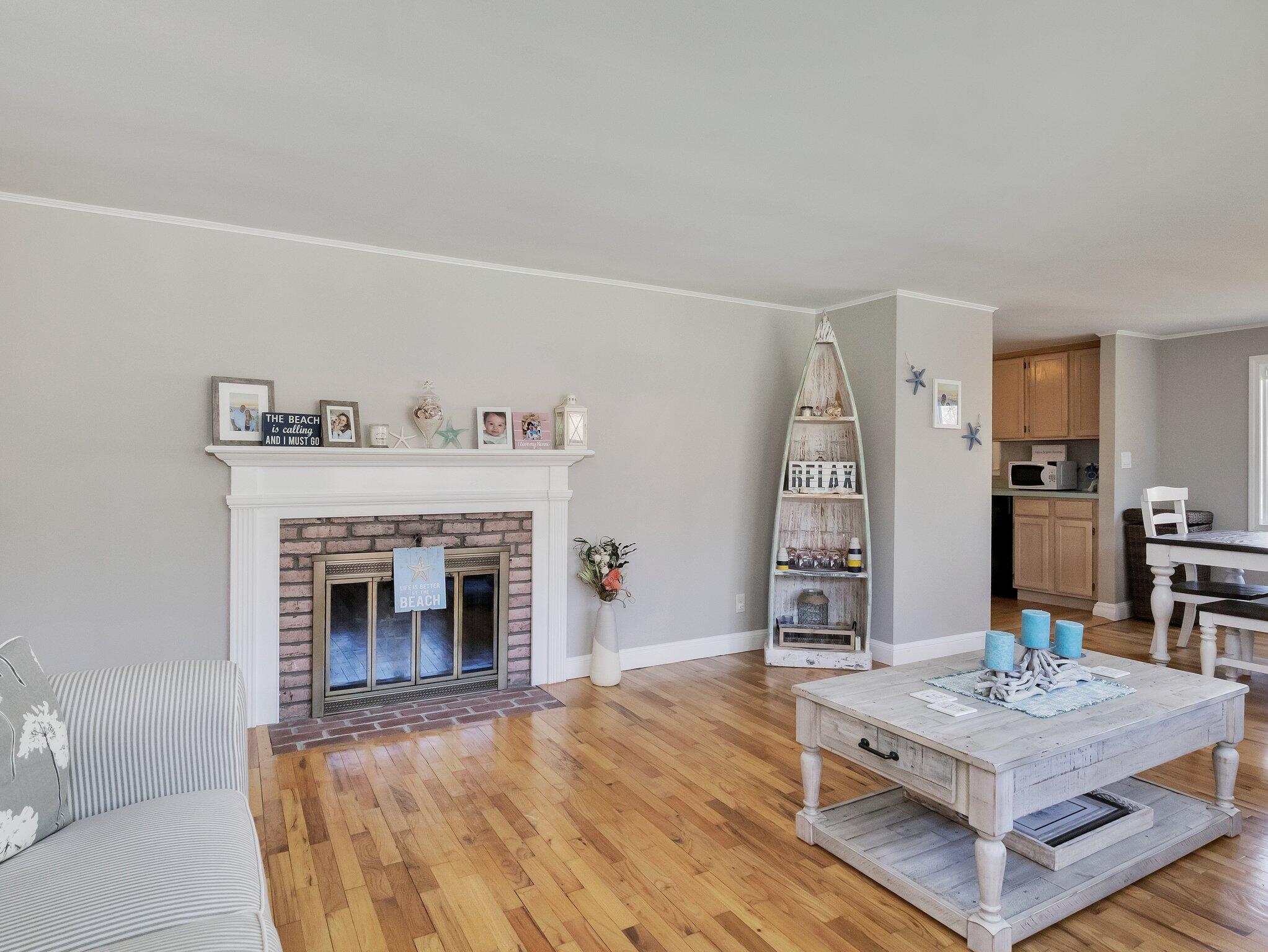41 Harbor Road West Yarmouth, MA 02673 - Photo 8 of 56 a living room with furniture and a fireplace