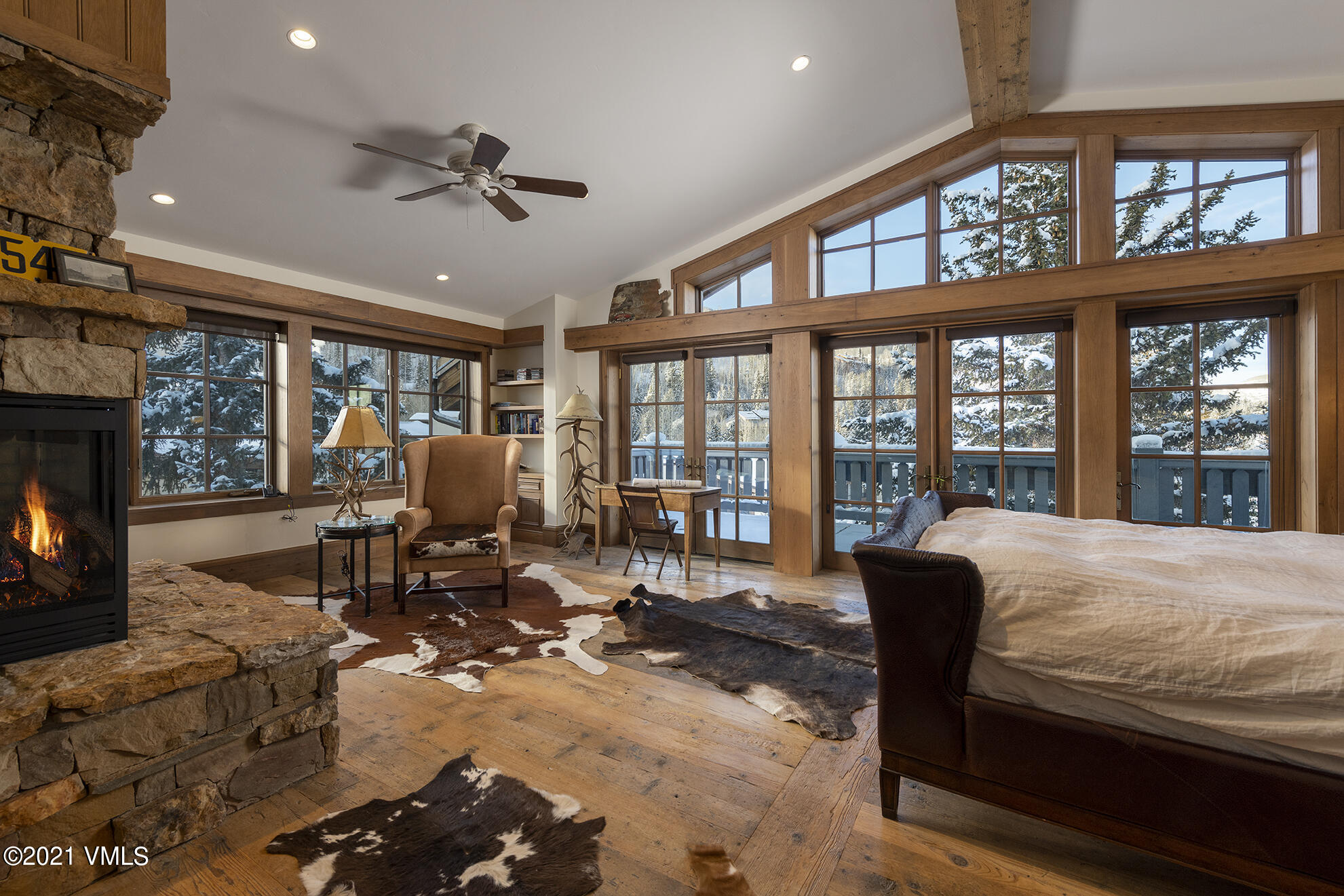 1 Willow Bridge Road, Unit 44 Vail, CO 81657 - Photo 3 of 16 a living room with furniture large windows and a fireplace