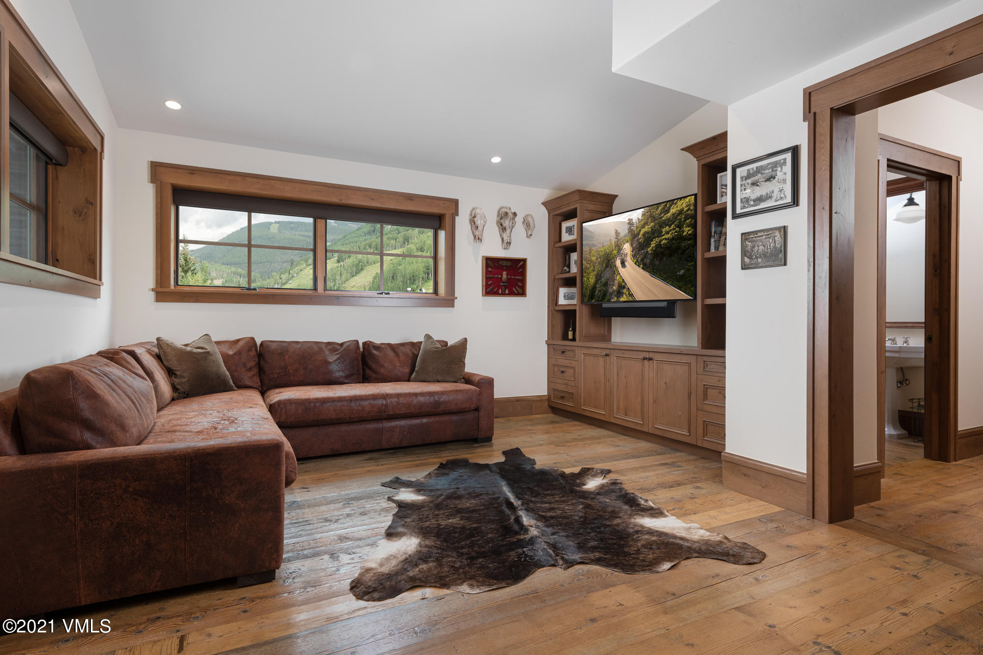 1 Willow Bridge Road, Unit 44 Vail, CO 81657 - Photo 8 of 16 a living room with furniture and a flat screen tv