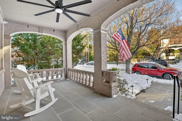 a very nice looking room with a large window and a chandelier